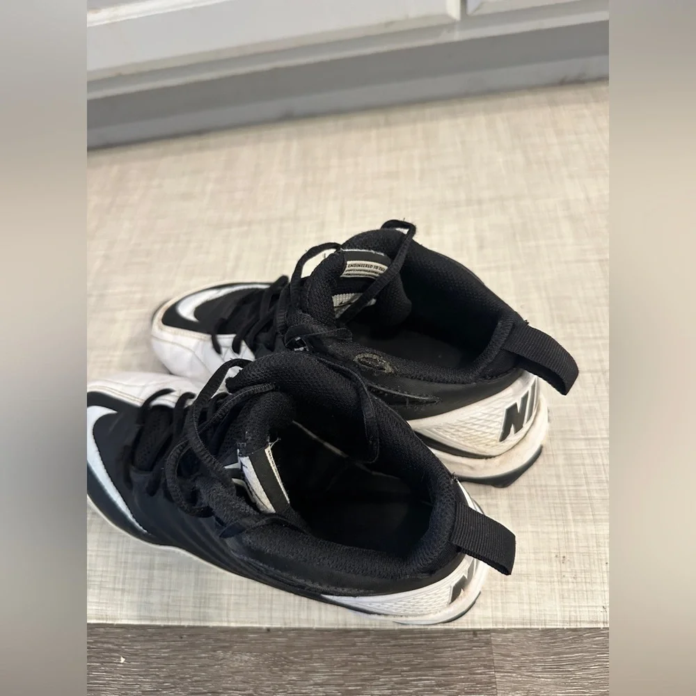 Nike Speed Shark 3/4 Football cleats in black and white.